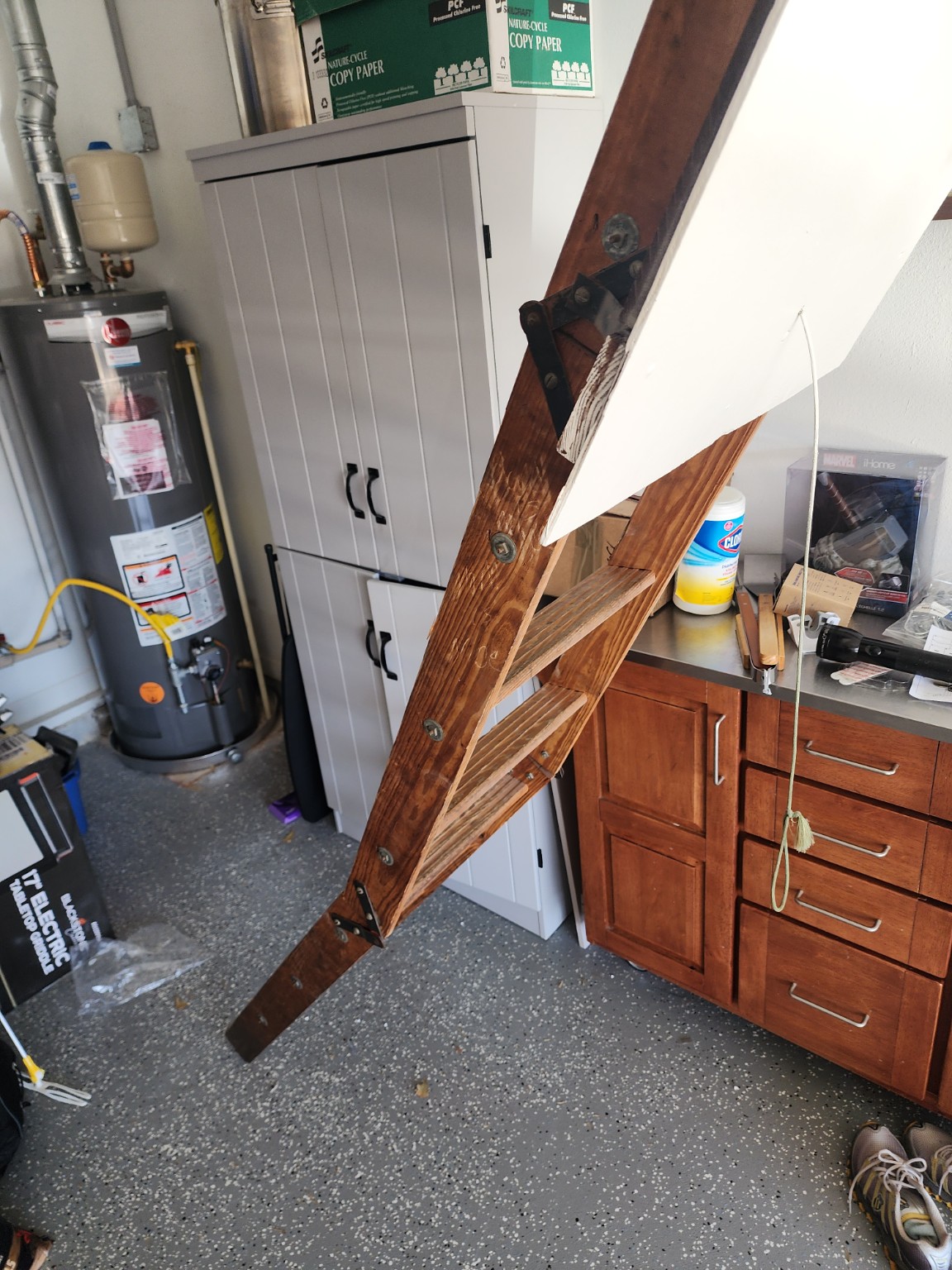 Old wooden attic ladder before replacement
