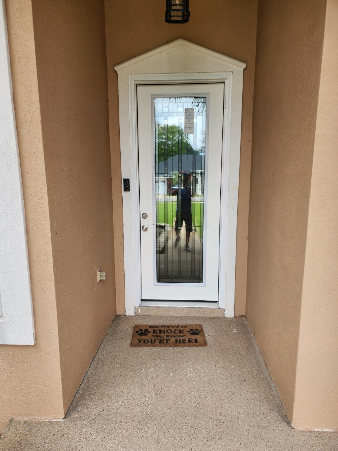 White entry door with decorative glass