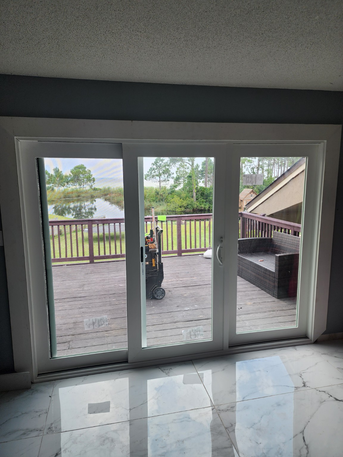Three-panel sliding patio door
